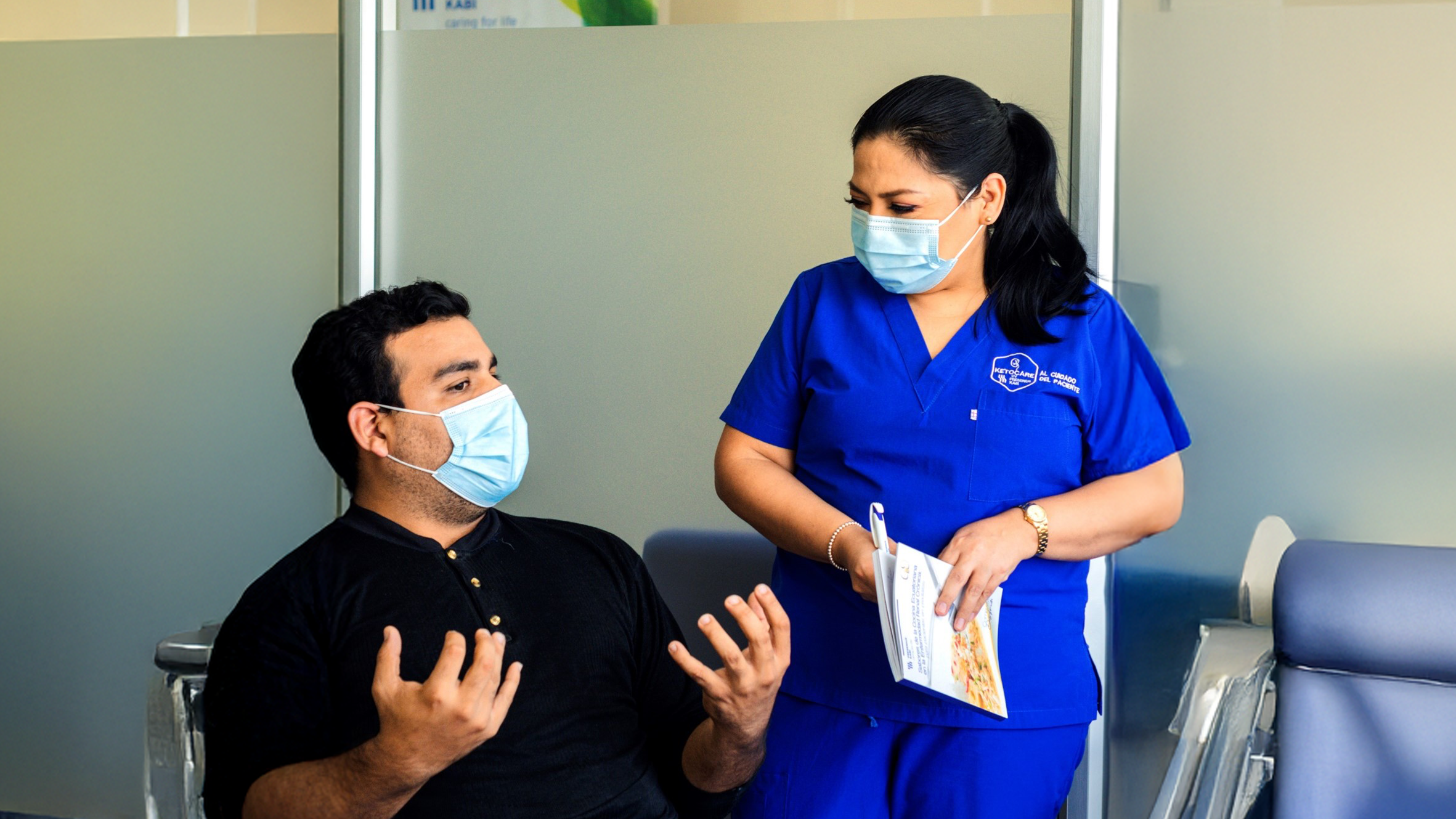 Guillermo talking to a caretaker.